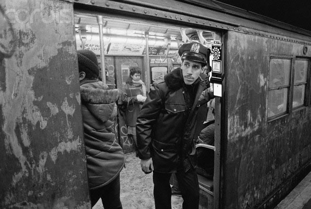 Police Officer Riding Subway Train