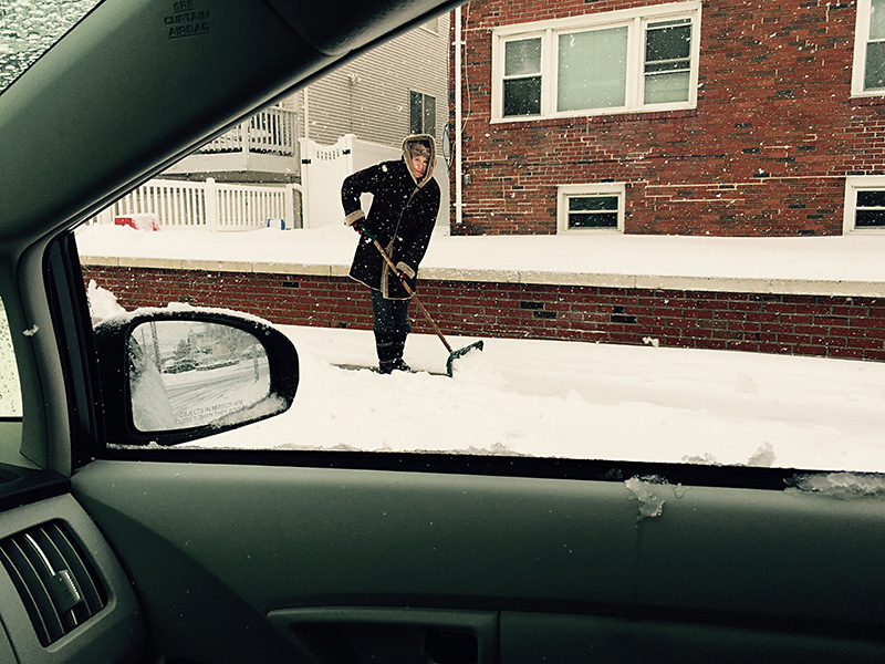Neighbor shovels snow FullSizeRender
